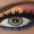 mac cosmetics rainbow eyeshadow fake eyelashes on a green eye